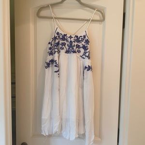 White gauze top with blue stitch detailing